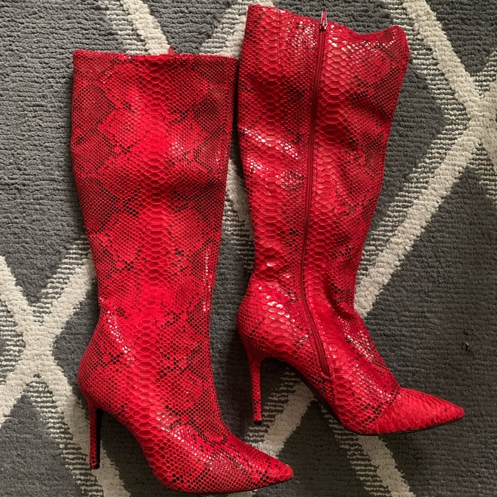 Black and red snake skin high boots